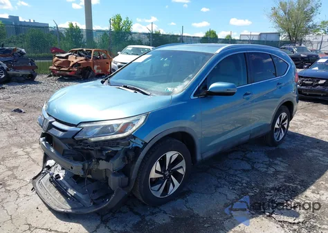 2016 Honda Cr-V Touring z USA, uszkodzony, nr VIN 5J6RM3H9XGL016595